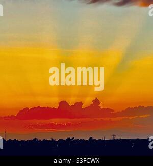 Sunset thunder clouds, sunset, thunder clouds, sun rays sunset, sun rays orange skies, horizon thunder cloud sunset Stock Photo
