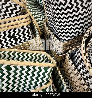 Stack of open-topped receptacles or boxes with graphic zig-zag pattern decoration. Stock Photo