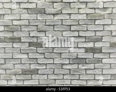 Uneven light-grey brick wall. Stock Photo