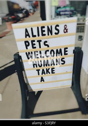 Store front sign in Roswell, New Mexico. Famous UFO Alien crash site in 1947 in Roswell desert. Hanger 84 was were alien and ufo debris were taken to before Area 51. Stock Photo