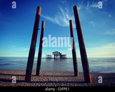 The remains of the West Pier at Brighton are pictured at low tide. Stock Photo