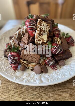 Biscoff Blondie and bourbon brownie stack with strawberries Stock Photo