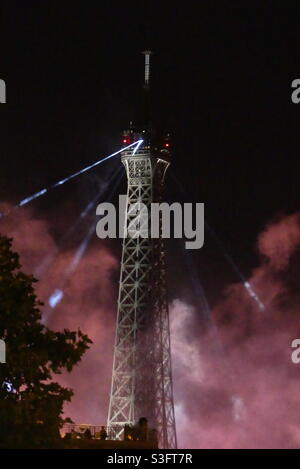 The Eiffel Tower with red smog during the fireworks on July 14th Stock Photo