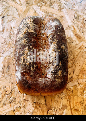Homemade granary bread on a wooden board Stock Photo