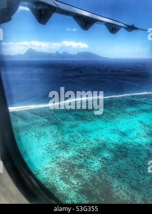 View of Moorea over the Tahiti lagoon from a flight leaving Pape’ete Stock Photo