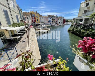 Canal with fishing boats, restaurants, flowers in Martigues, near Marseille, Bouches-du-Rhône, Provence-Alpes-Côte d'Azur, south of France Stock Photo