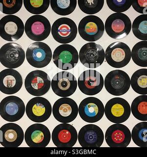 7 inch singles - vinyl records display - retro vintage music - circles of old vinyl records Stock Photo