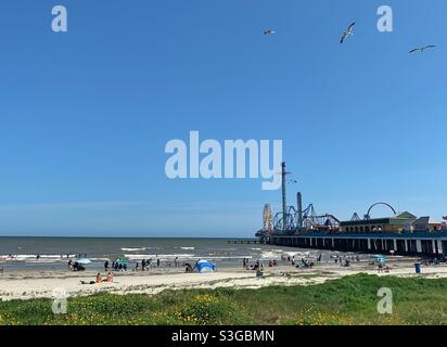 Pleasure Pier with carnival rides at the beach in Galveston, Texas Stock Photo