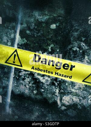 A danger warned by sign about Asbestos hazard or n a building site Stock Photo