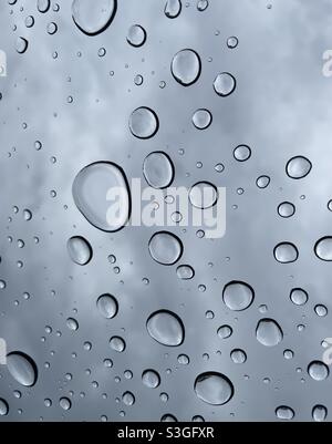 Abstract background of raindrops on glass Stock Photo