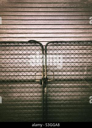 Closed metallic gates. Stock Photo