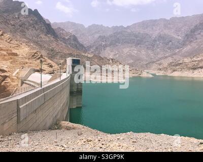 Wadi Dhiqa water Dam, Oman:with low level of water in mid summer Stock Photo