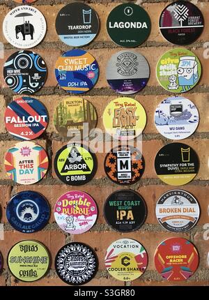 Beer pump clips on a pub wall Stock Photo