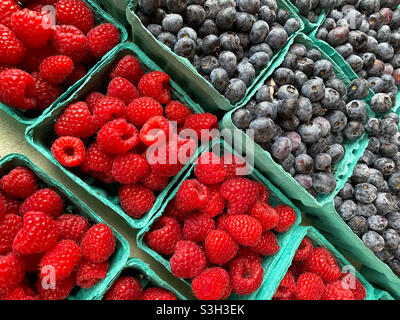 Blueberries and raspberries at a farmers market Stock Photo