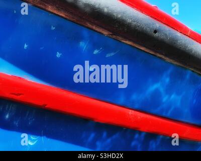 Detail of a colourful fishing boat moored in a Cornish harbour, August. Stock Photo