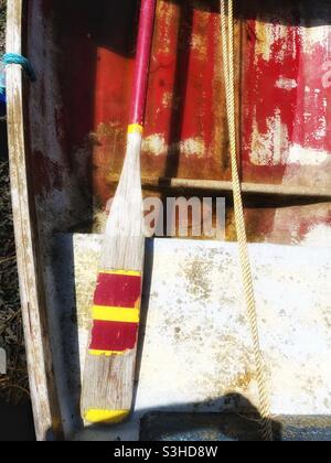 Detail of small rowing boat moored in a Cornish harbour, August.