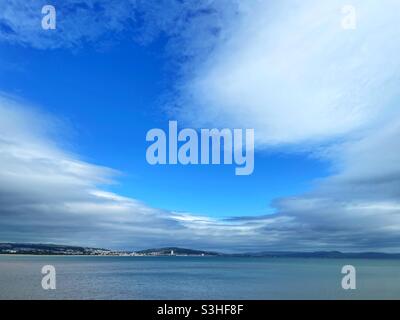 Break in the clouds over Swansea Bay, Wales. Stock Photo