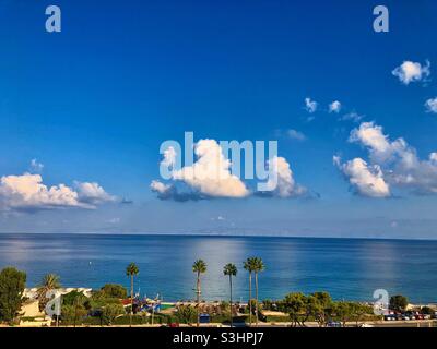 Sea view at the beach with tall palm trees near Ialysos, Rhodes island, Greece. Stock Photo