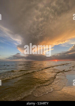 Tall cloud formation at sunset over Gulf of Mexico Stock Photo