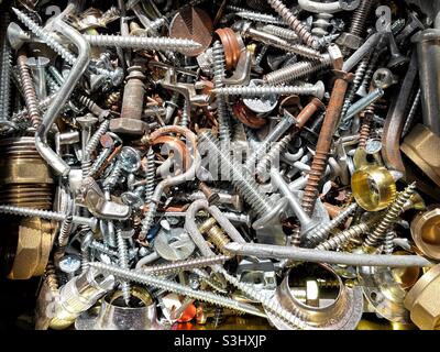 Close up view of metal screws, nuts and bolts Stock Photo
