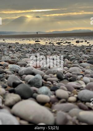 Sunset on a stony beach Stock Photo