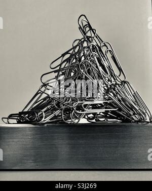 Paper clips on a magnetic bar Stock Photo