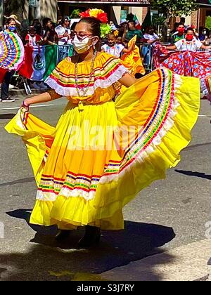 Bright yellow dress on traditional Mexican dancer Stock Photo
