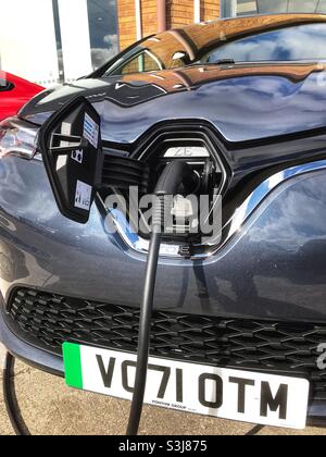 Brand new 71 registration Renault Zoe electric car being charged on a dealers forecourt September 2021 Stock Photo
