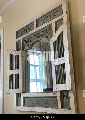 Vintage mirror with louvered doors, USA Stock Photo