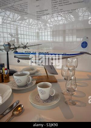 Display case of model airplane and dinner service from Pan American Airways at the Cradle of aviation Museum , Garden City Long Island, New York, 2021, USA Stock Photo