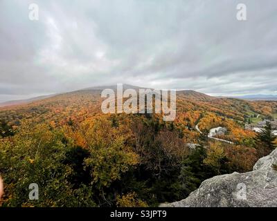 Peak fall foliage in the Green Mountains of Vermont overlooking Pico Mountain Resort in Killington. Stock Photo