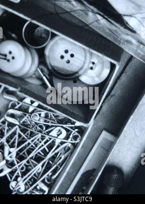 Vintage sewing box with buttons and safety pins Stock Photo
