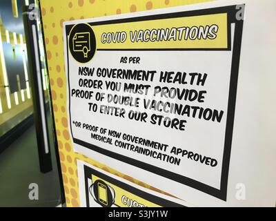 Vaccine passport sign at the entrance to a JB-HiFi electronics store in Sydney, NSW, Australia Stock Photo