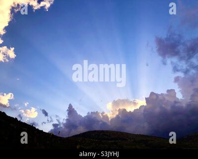 Sunset In Culla, Spain with light rays through the clouds Stock Photo