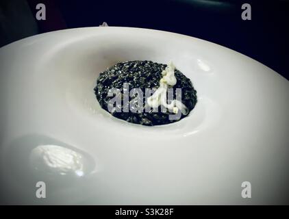 Squid ink risotto Stock Photo - Alamy