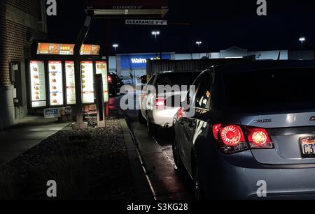 At a fast food drive thru after dark. Stock Photo