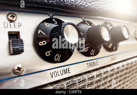Close-up view of the knobs of an amplifier for adjusting the sound of stringed musical instruments. Concert and live performance. Music and entertainment Stock Photo