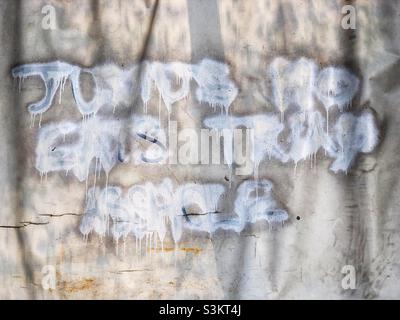 Ineffectively obscured graffiti insulting Junius Ho, a pro-Beijing Hong Kong Legislative Council member who was vocal and active in opposition to the 2019 anti-Extradition Bill protests, 2020 Stock Photo
