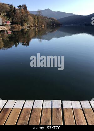 View over Lake Caldonazzo in Trentino, Northern Italy, on a sunny autumn day Stock Photo