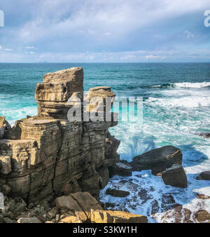 The dramatic rocky coastline is beaten by Atlantic waves, along the coastline at Peniche ,Portugal Stock Photo