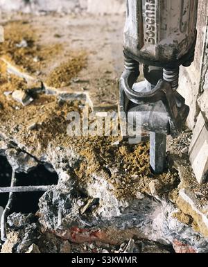 Drill hammer in concrete on a construction site Stock Photo