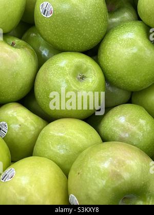 Close shot of fresh green apples for sale in the produce department of a local Walmart in Utah, USA. Stock Photo