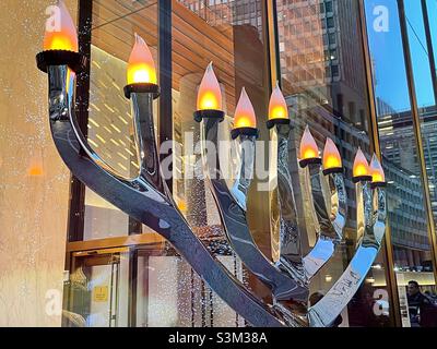 To commemorate Hanukkah, a large menorah is lit at One Vanderbilt plaza in Midtown Manhattan, 2021, New York City, United States Stock Photo
