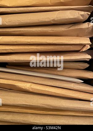 A stack of brown manila envelopes seen from the edge Stock Photo