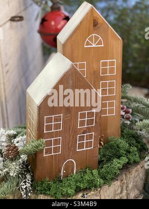Christmas tine with wooden house art work Stock Photo