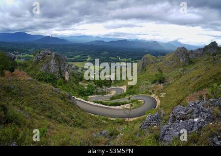 The winding roads of Burake hills where stand the statue of Jesus Christ Blesing at Makale in Tana Toraja Regency, South Sulawesi, Indonesia. Stock Photo