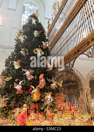 The Christmas tree in the medieval sculpture hall at the Metropolitan Museum of Art during the holiday season, 2021, New York City, United States Stock Photo