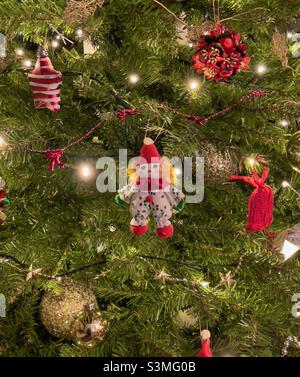 A detail of a Christmas tree with decorations and lights Stock Photo