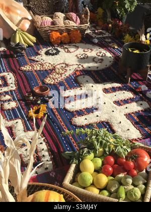A dia de los Muertos alter with a skeleton made of rice with fruit and vegetables. Stock Photo