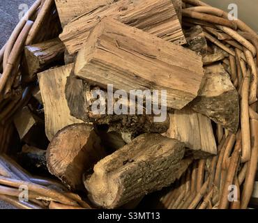 Hey close up of a basket of split logs, fuel for open fires Stock Photo